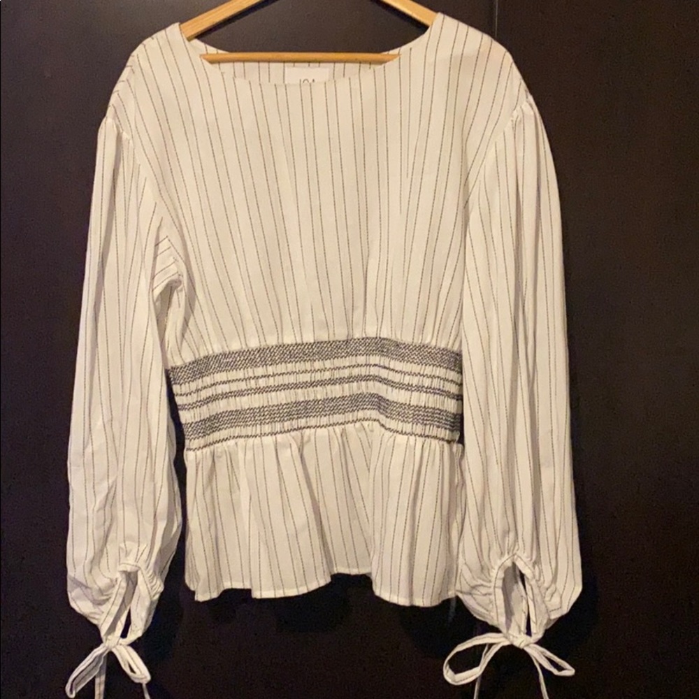 White and black stripe peplum blouse.